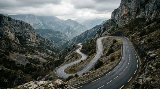 Modern vehicle camera system monitoring lane markings on challenging narrow mountain road