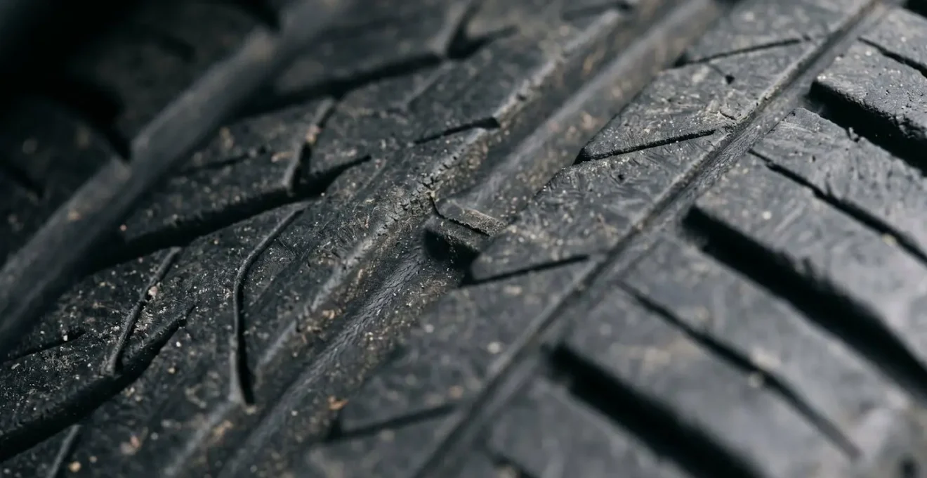 Extreme close-up macro photograph of tire tread groove showing depth and texture